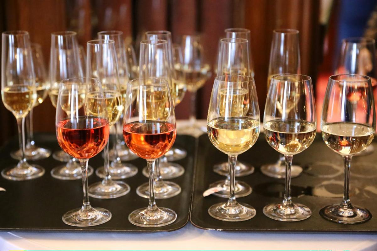 a group of wine glasses sitting on a tray