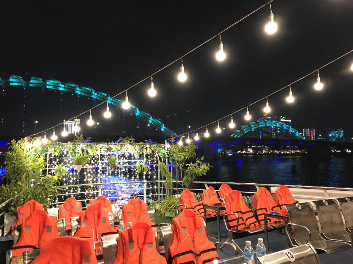 a stage with orange chairs and a stage with lights