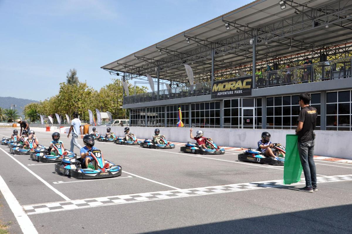 a group of people riding onicycles on a race track