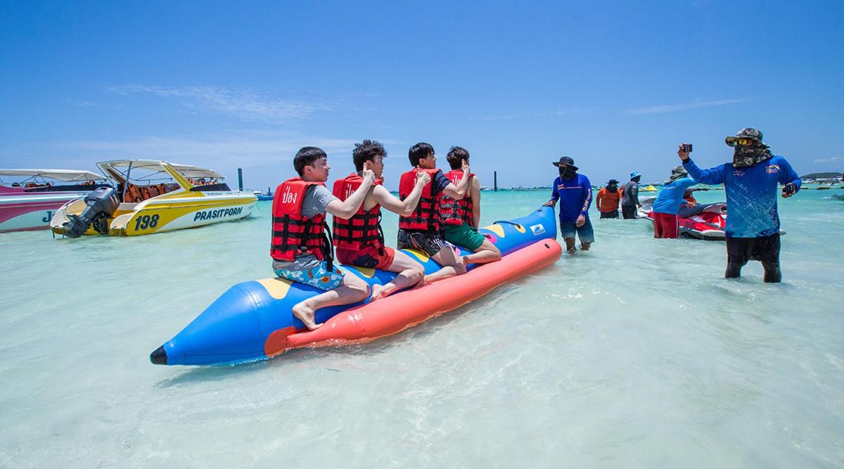 a group of people riding on a raft in the water