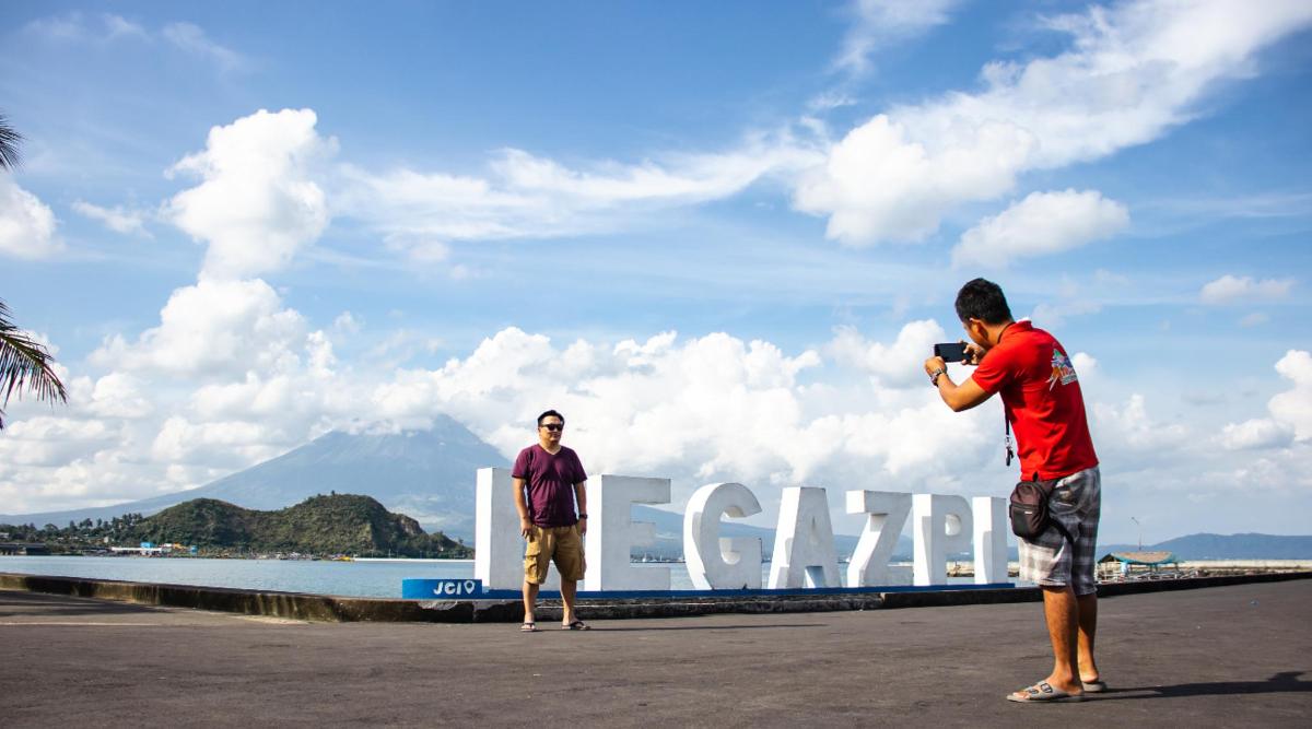 a man taking a picture of another man with a camera
