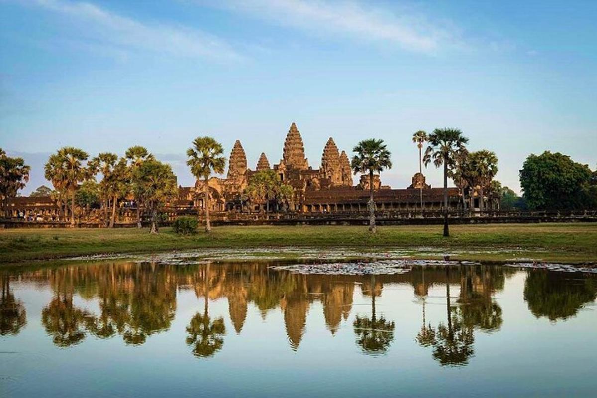 a reflection of a temple in a body of water