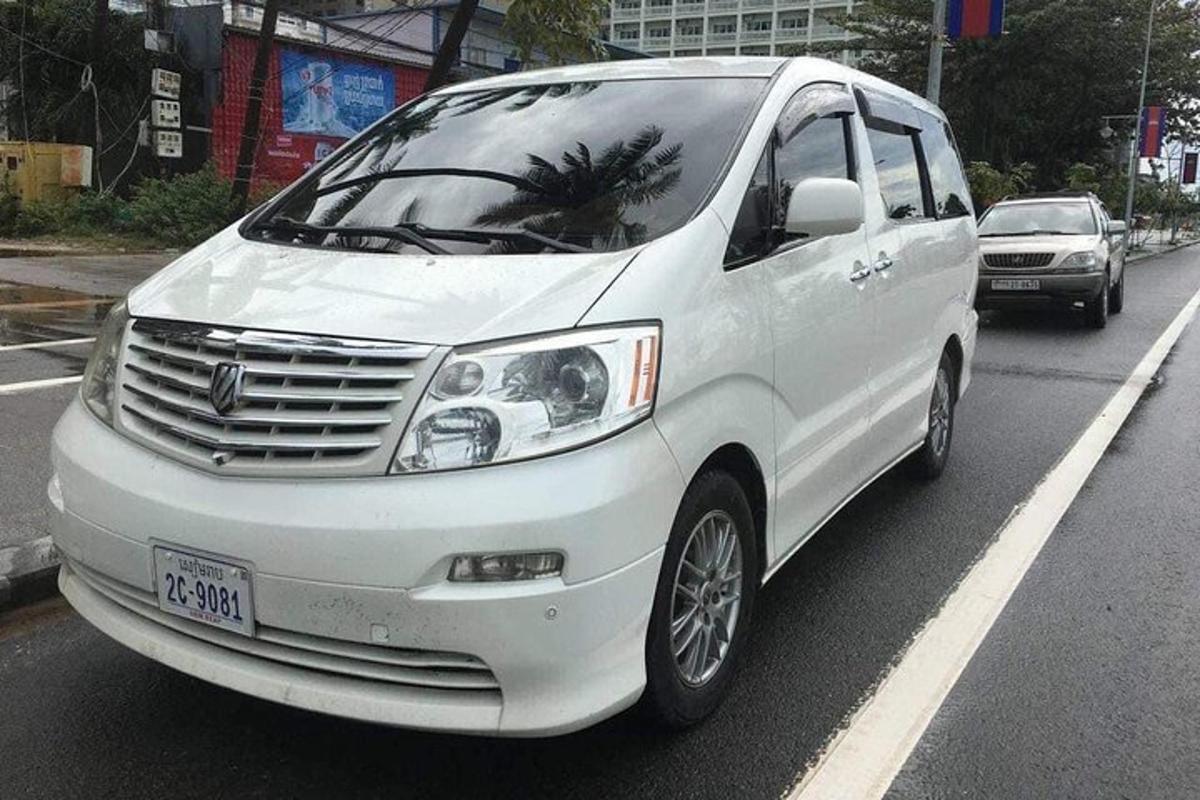 a white van is parked on a city street
