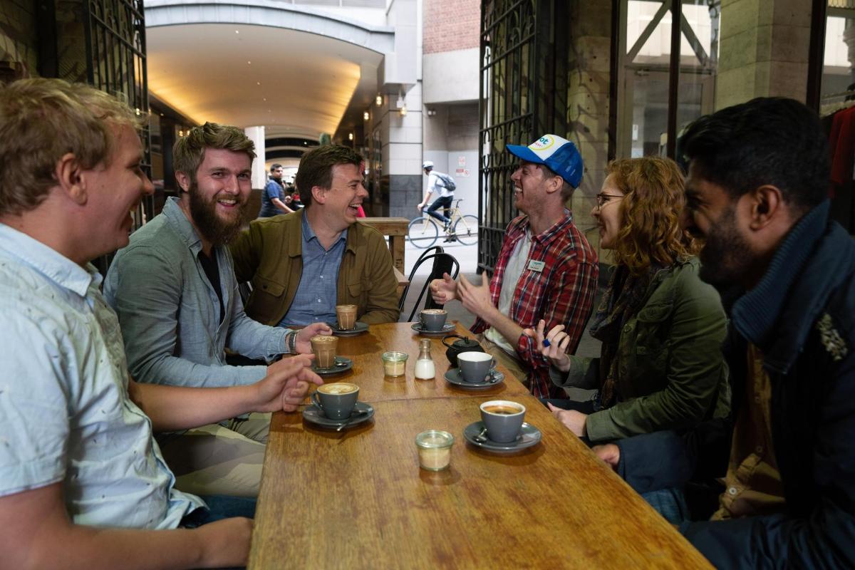 a group of people sitting around a table