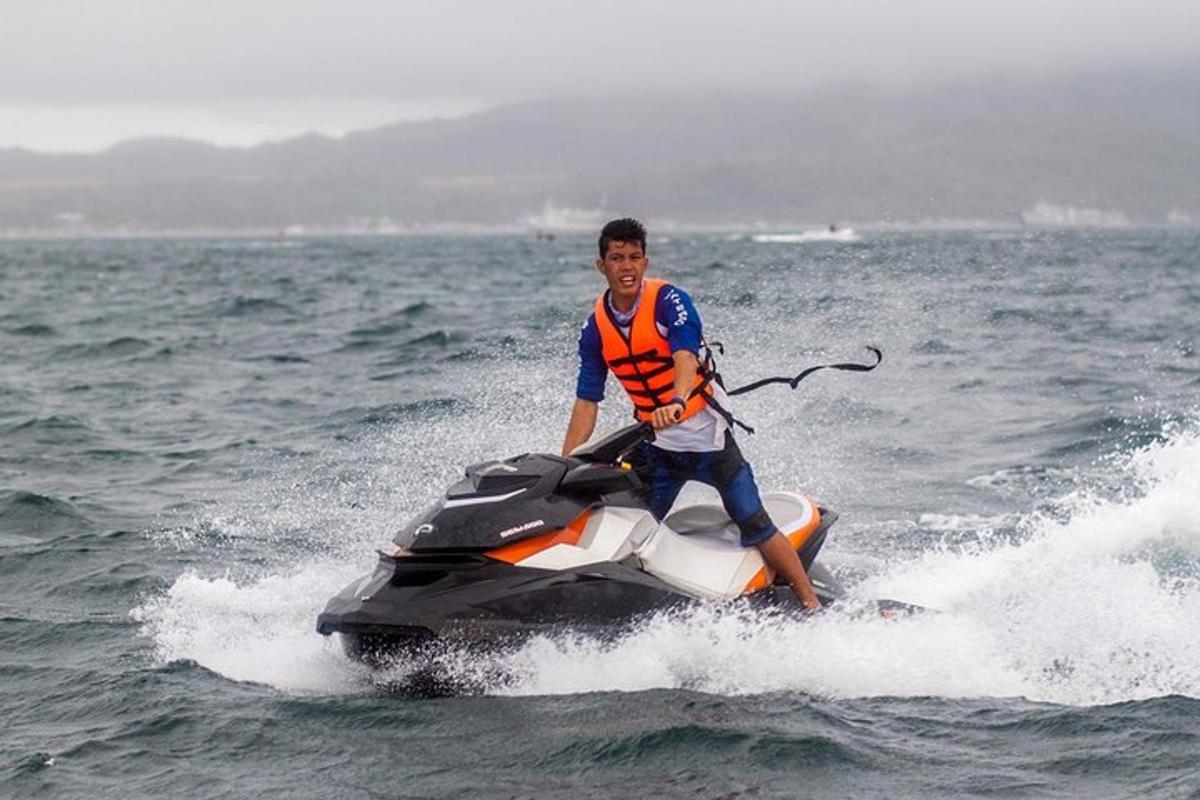 a man riding a jet ski in the water
