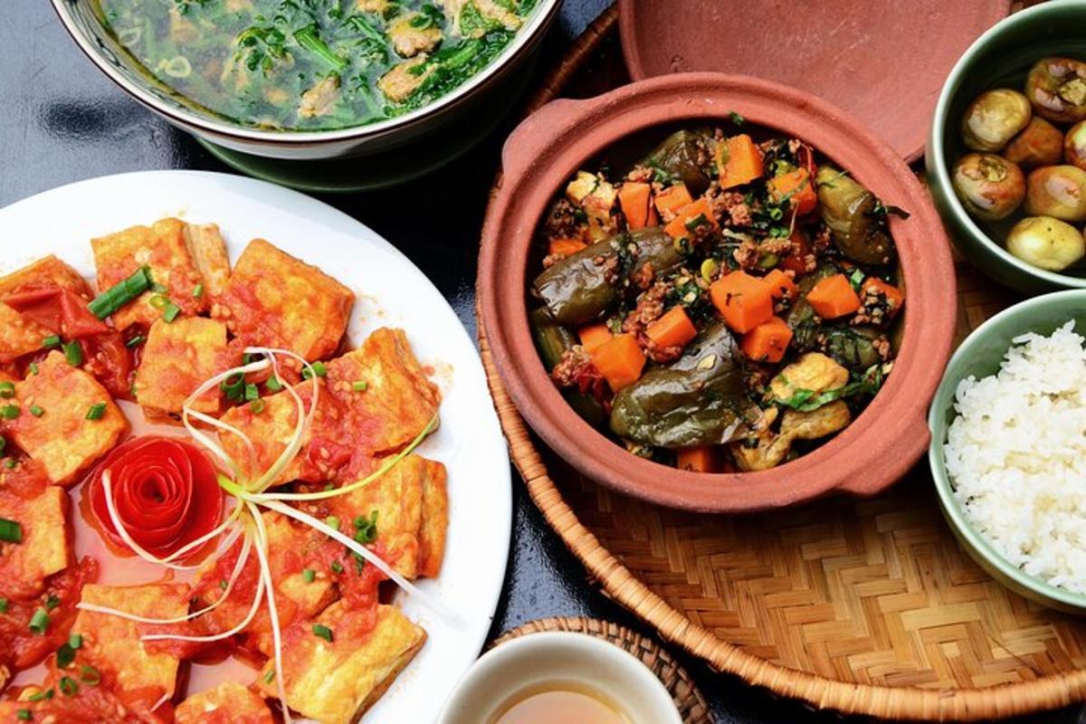 a table with plates of food and bowls of food