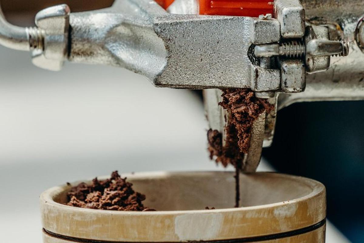 a machine with a bowl of dirt in it