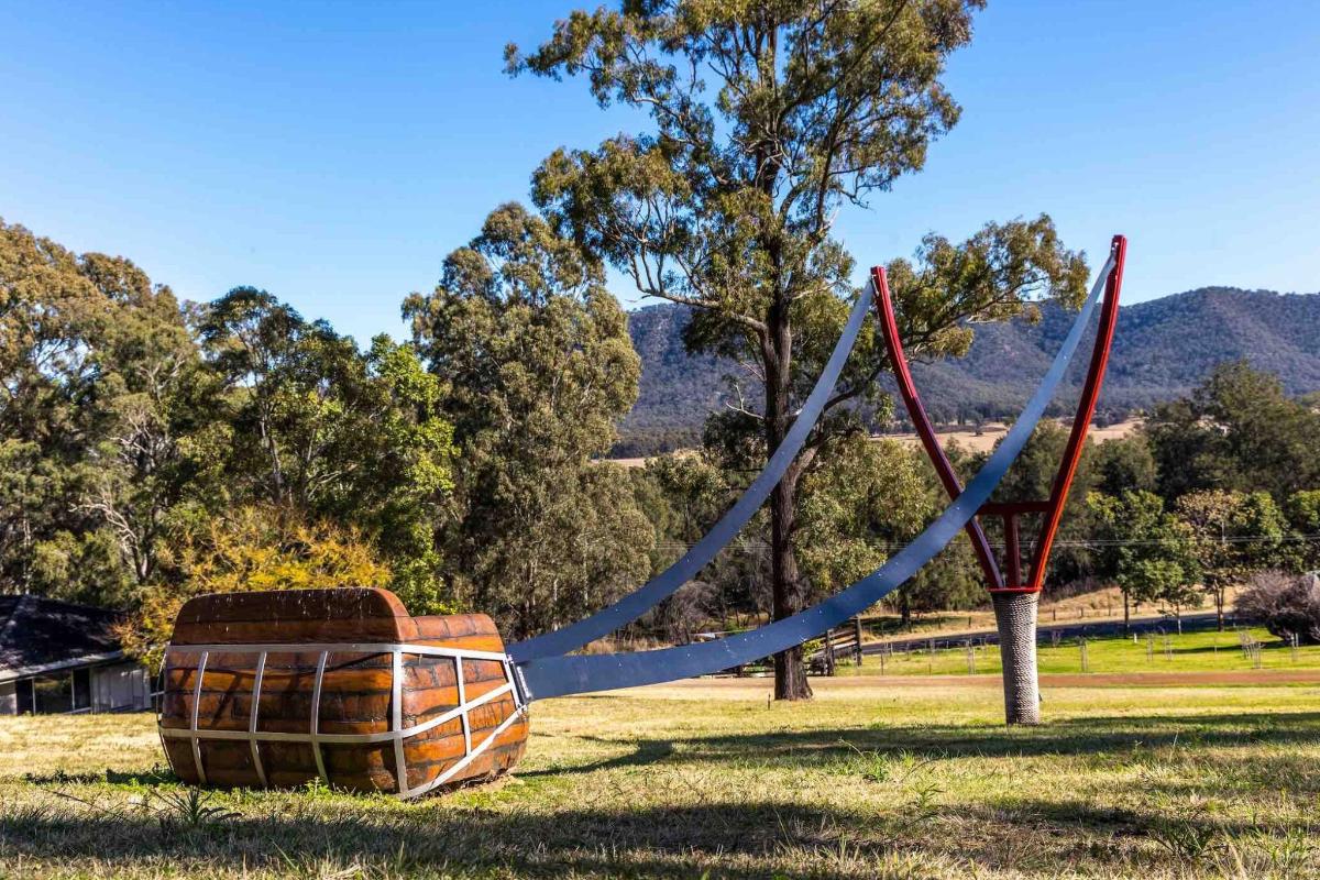a swing set with a blue rope in a park