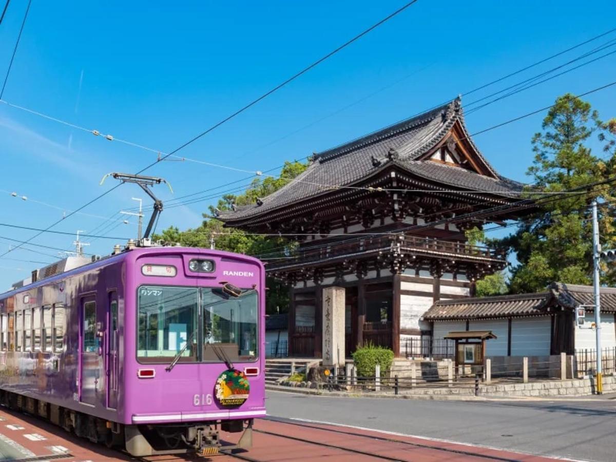 a purple train in front of a building