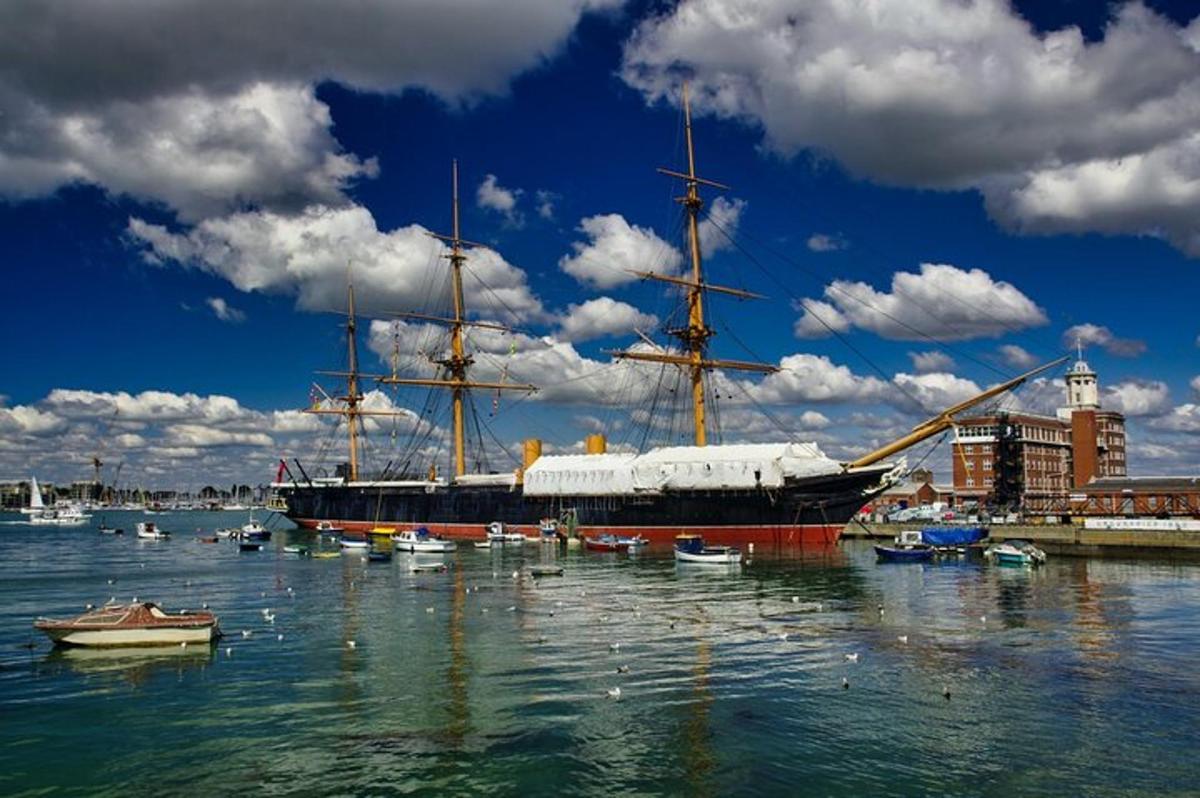 a large ship is docked in a harbor