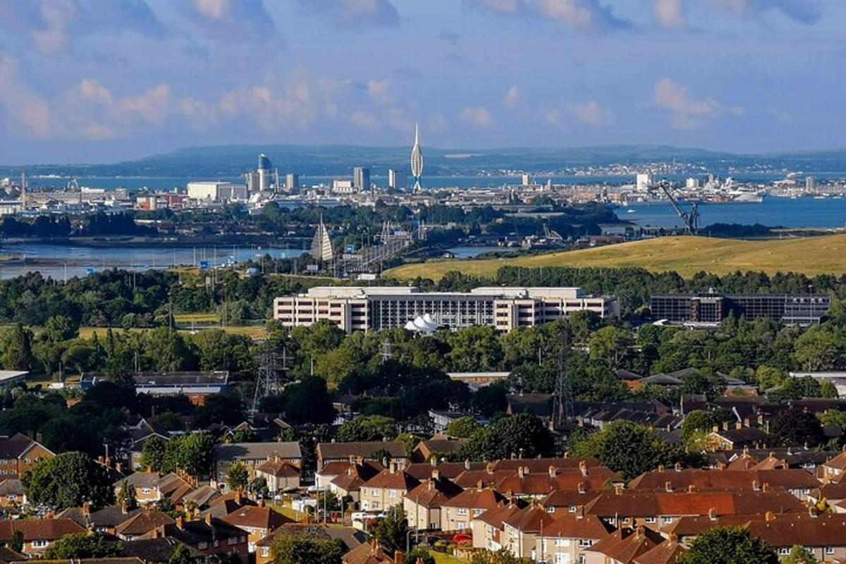 a cityscape of a city with a river and buildings