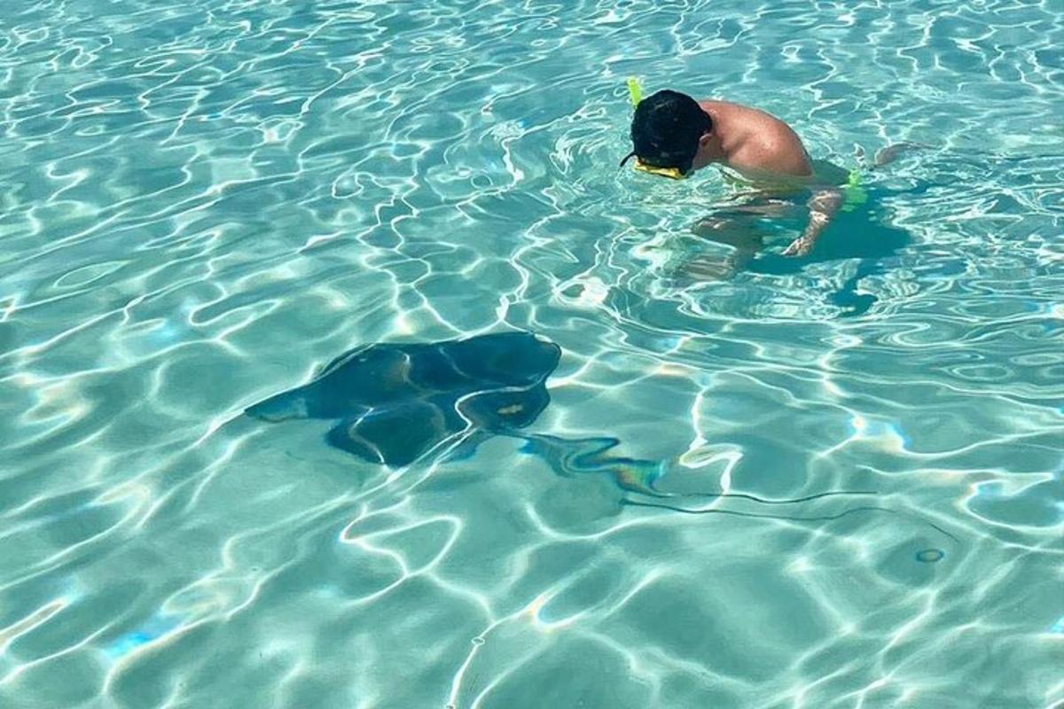 a man swimming in a pool of water
