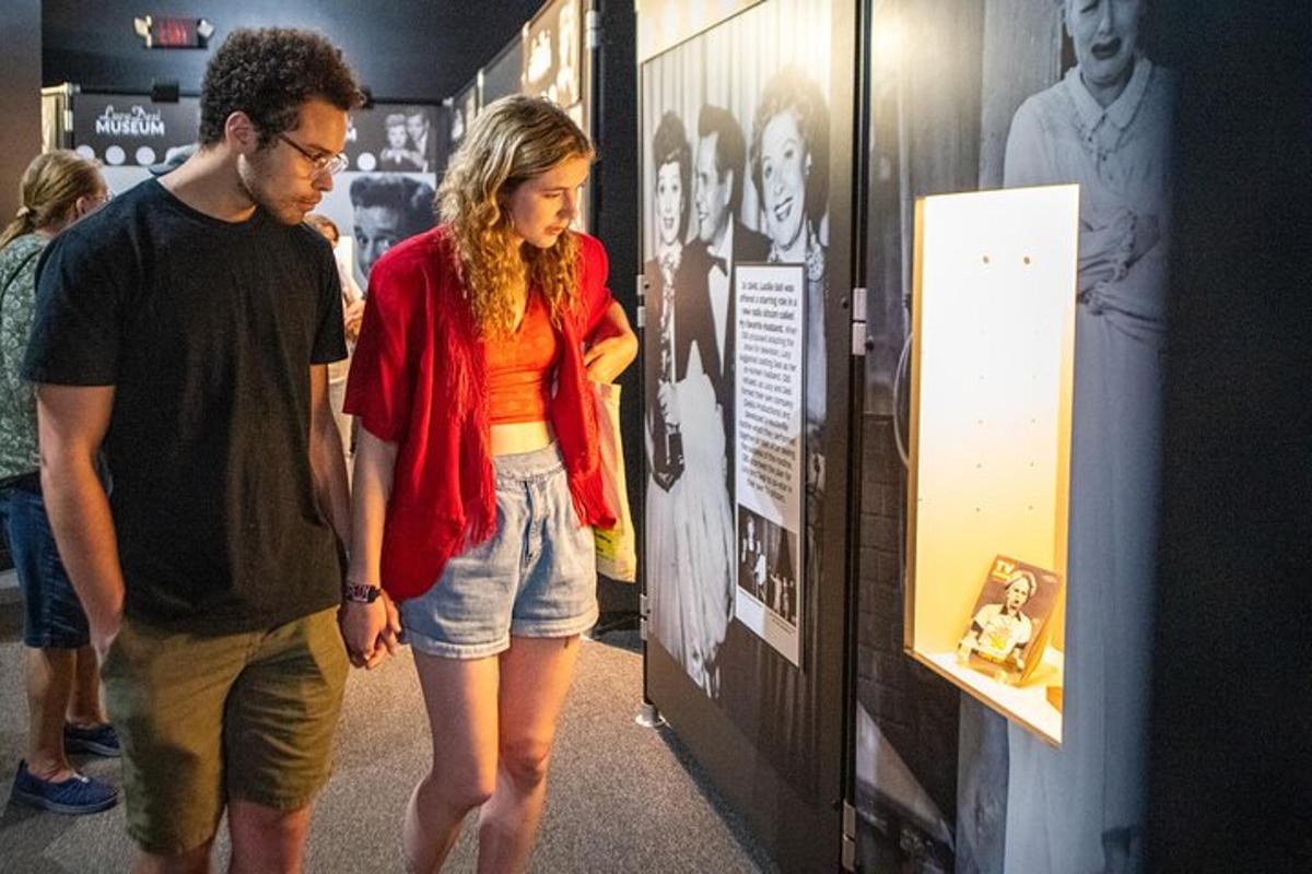a man and a woman walking through a museum