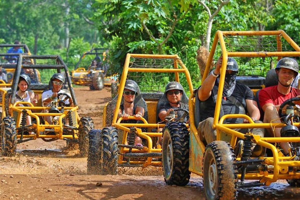 a group of people riding in an off road vehicle