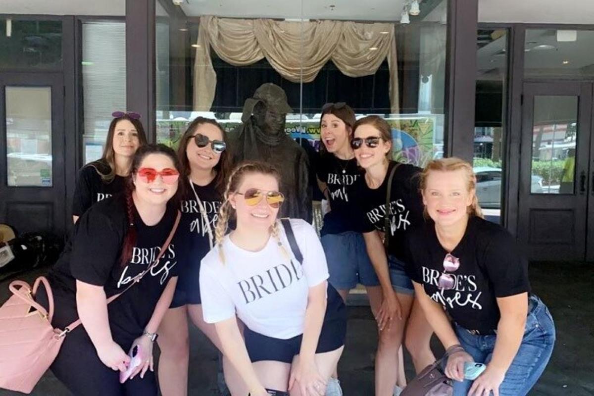 a group of people wearing black shirts posing for a picture