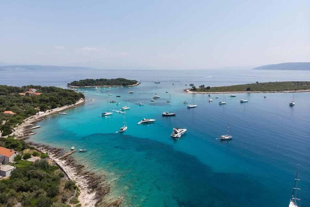 an aerial view of a harbor with boats in the water