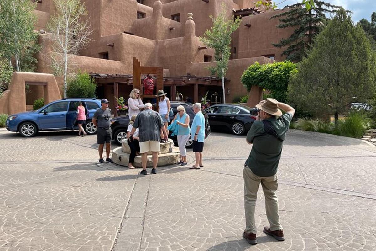 a group of people standing around in a parking lot