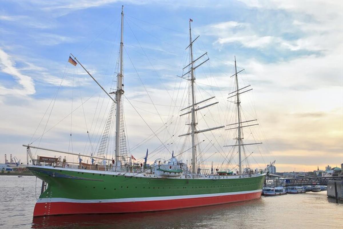 a large green boat sitting in the water