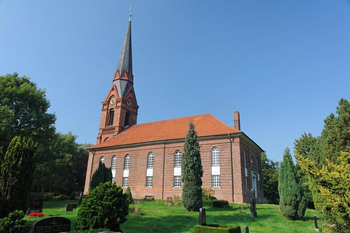 a large brick church with a clock tower on top