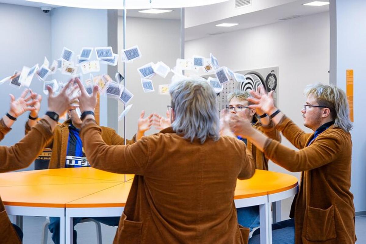 a group of people with their hands in the air