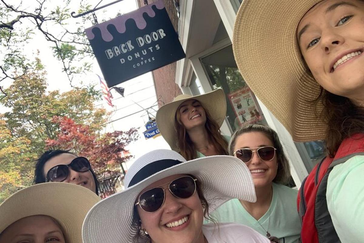a group of women wearing hats in front of a store