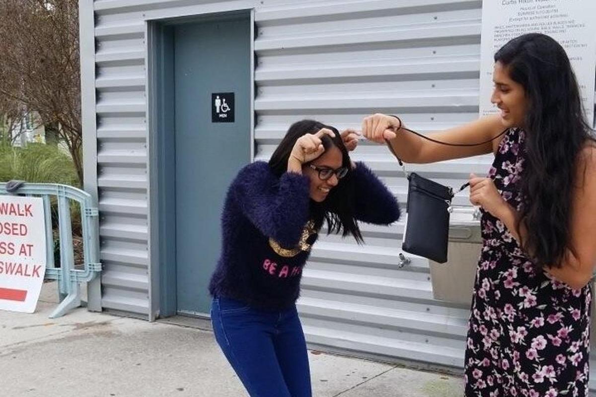 two women are getting their hair cut