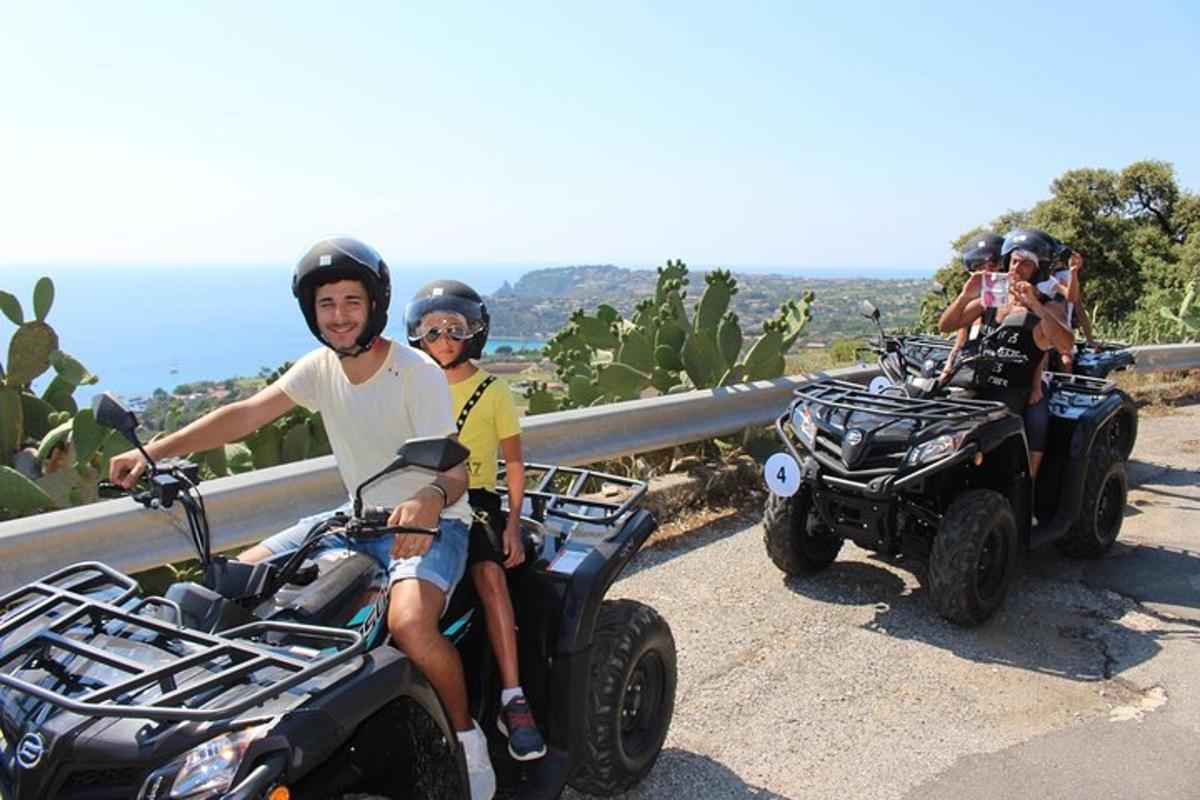 a group of people riding atvs on a road
