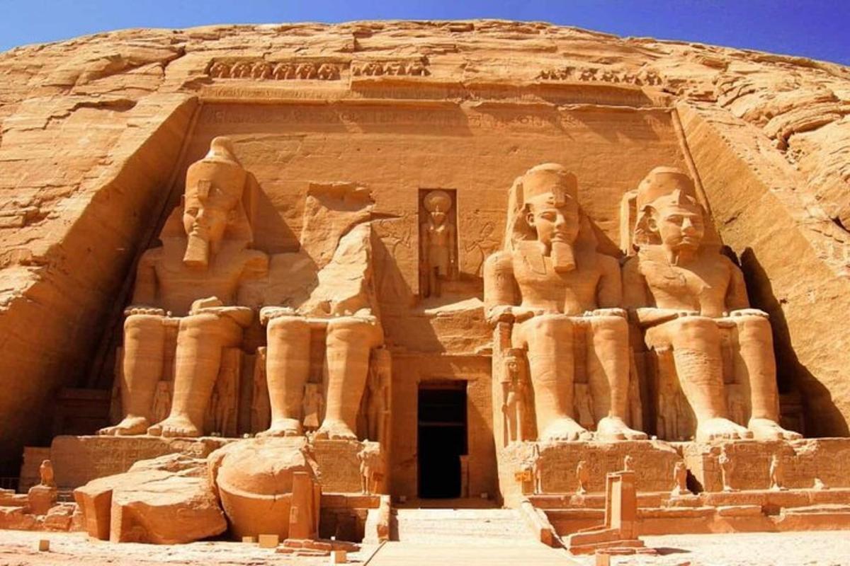 a building with statues on it in the desert