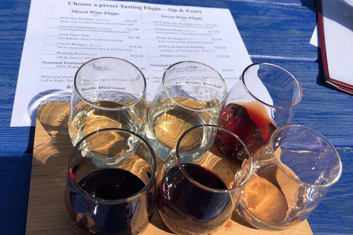 four glasses of wine sitting on top of a table