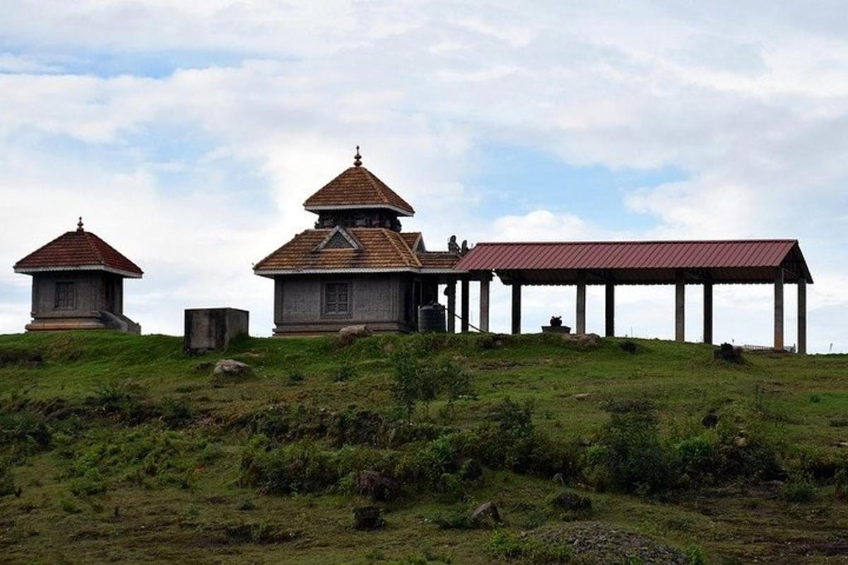 a building on top of a grassy hill