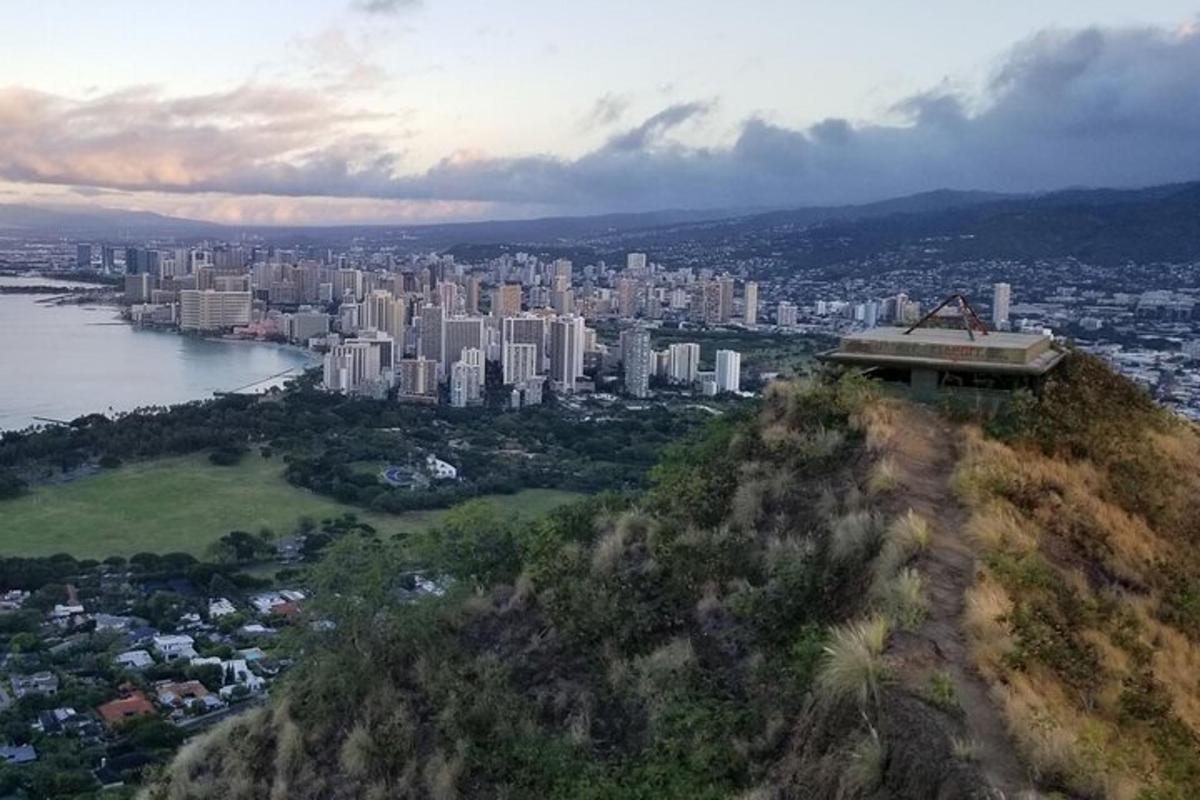 a view of a city from a hill with buildings