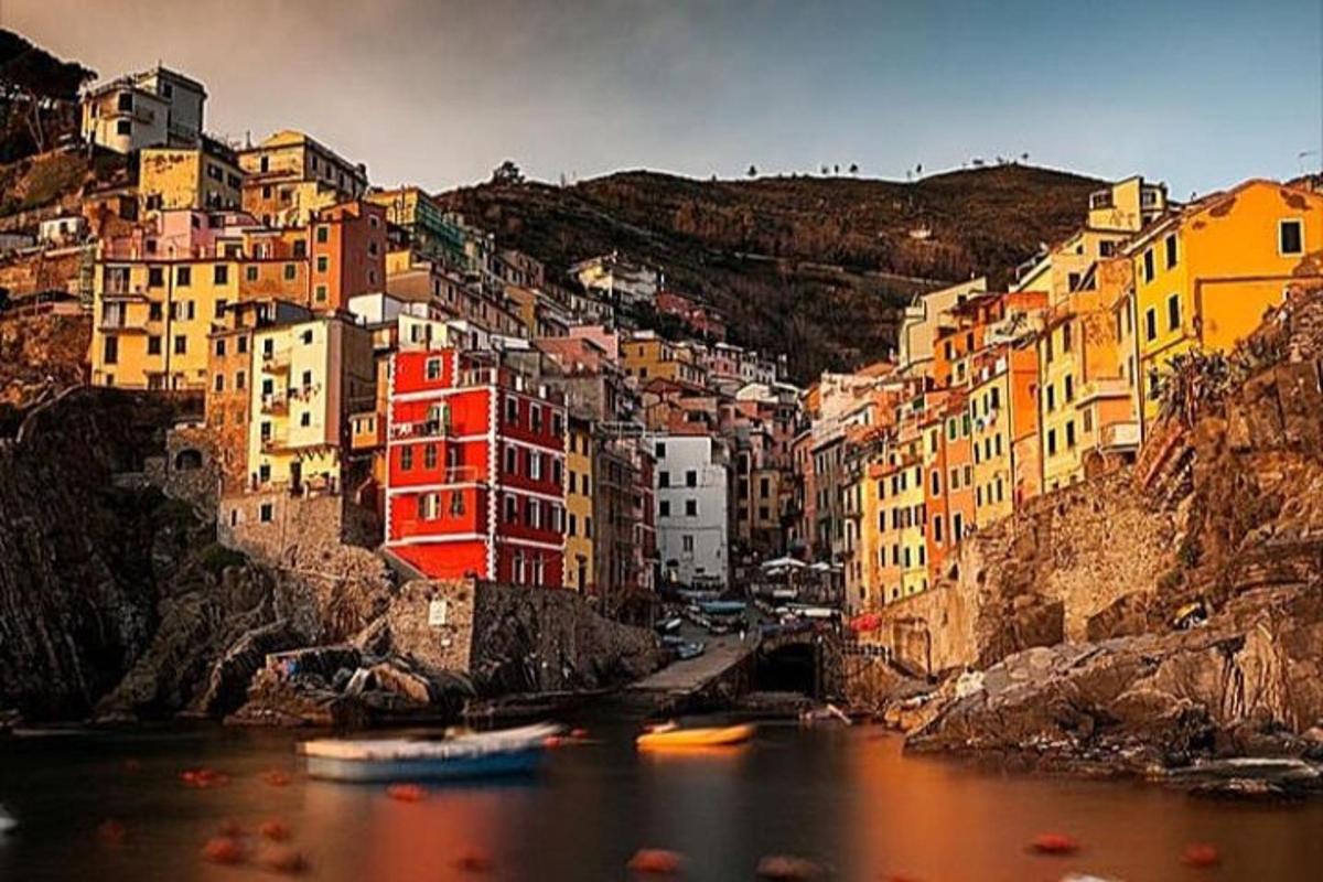 a group of colorful buildings on the side of a river