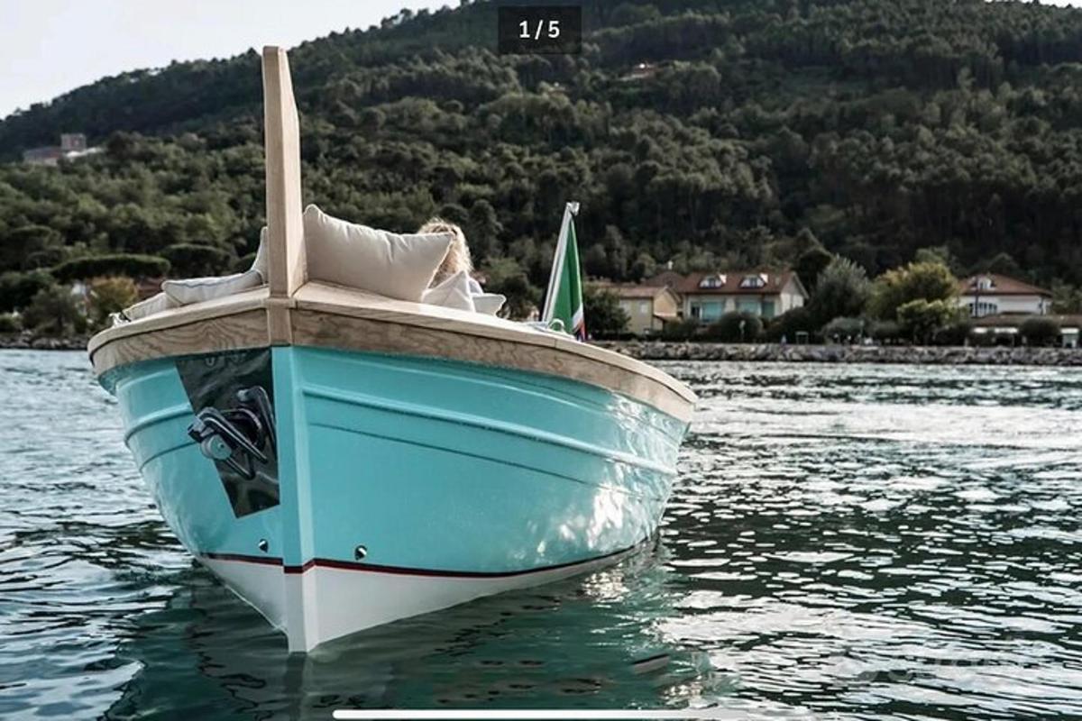 a woman is sitting on a boat in the water