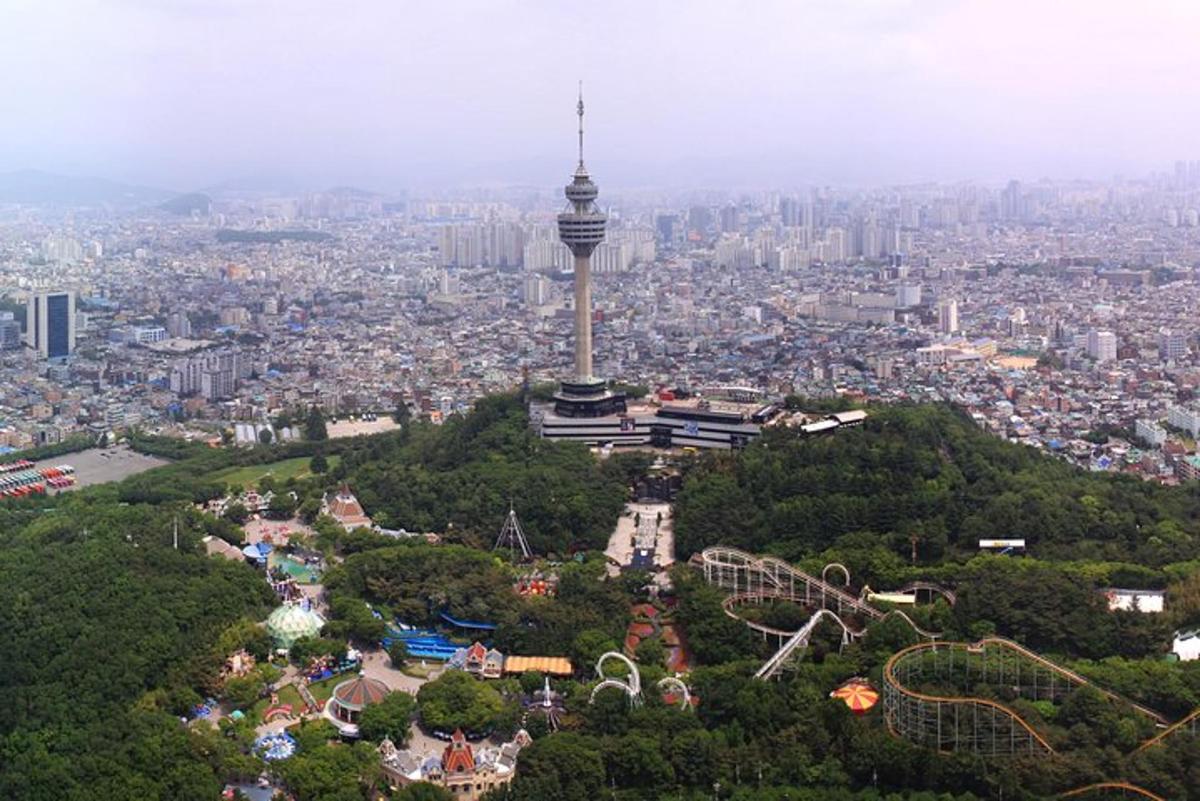 a view of a city with a tower on a hill