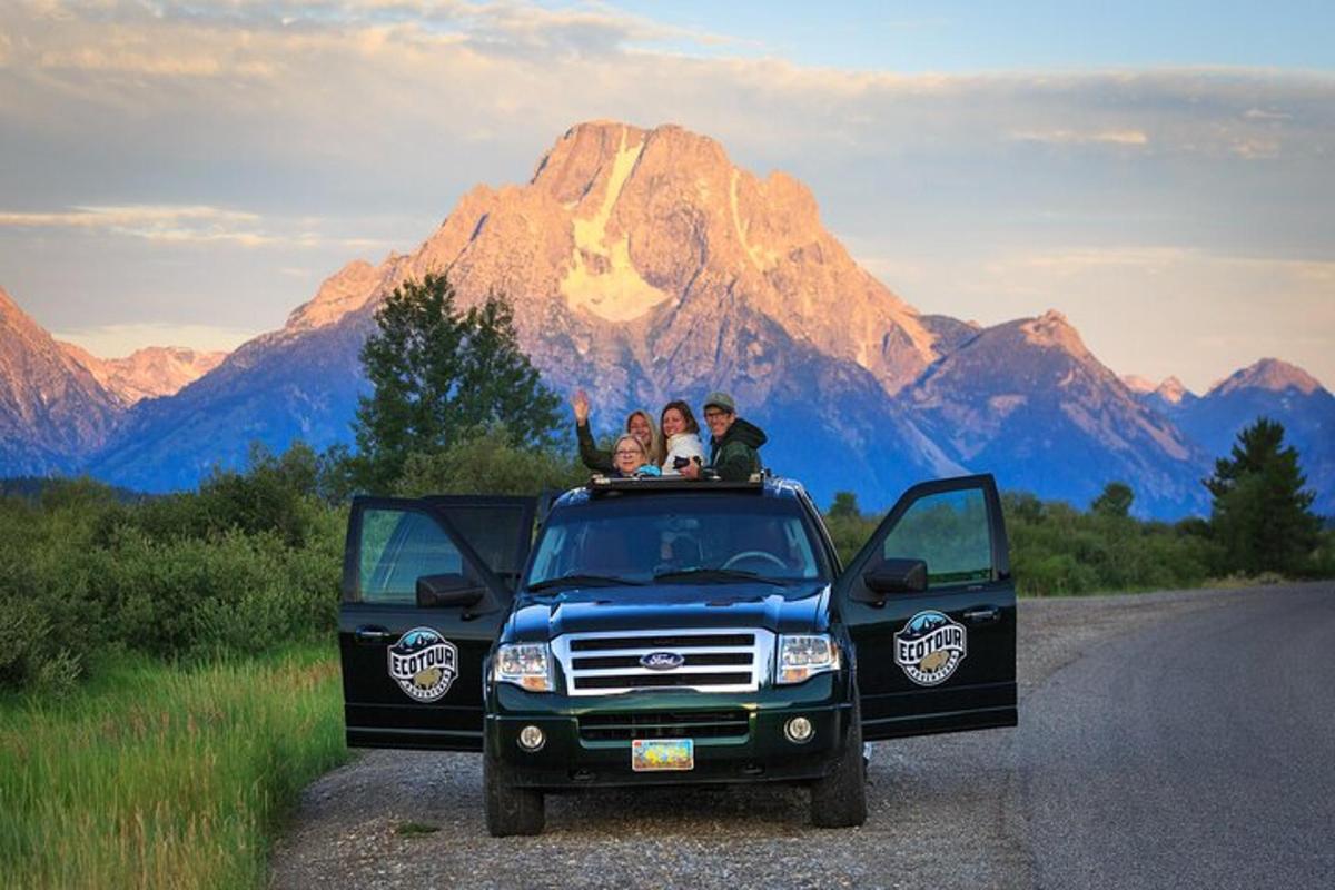 a group of people sitting in the back of a truck