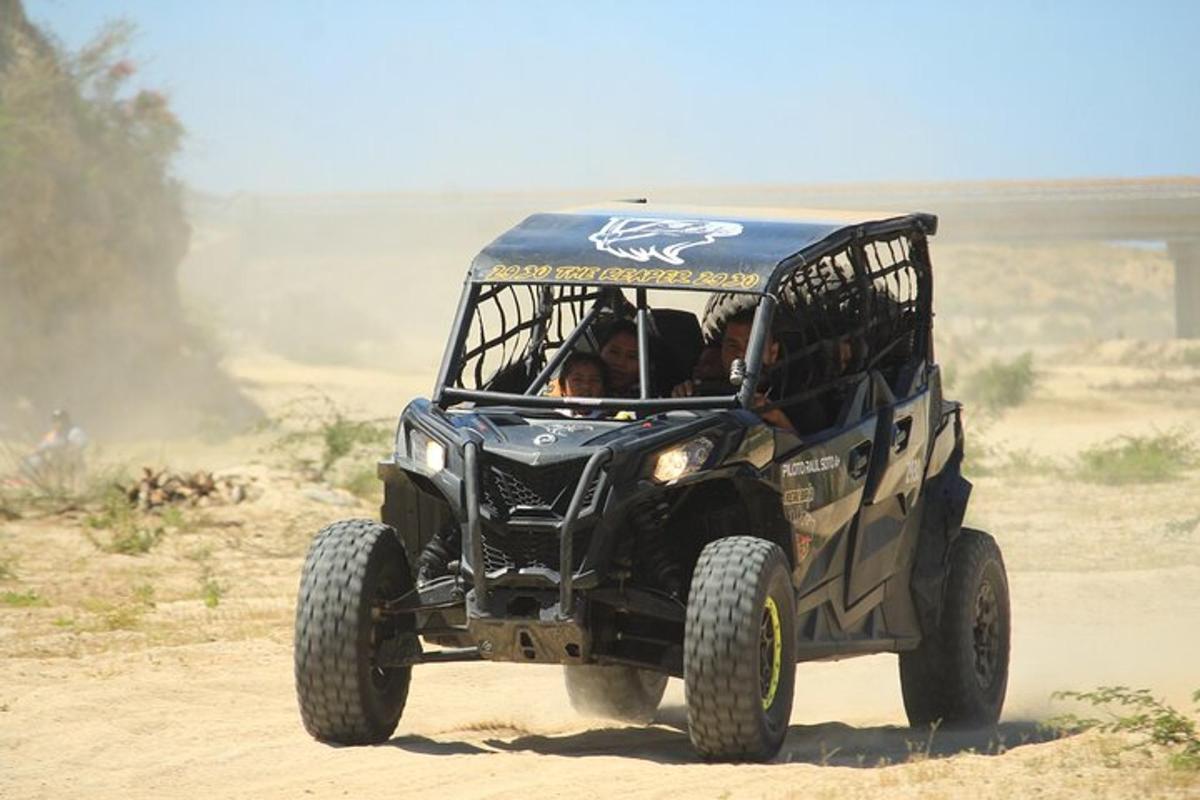 a black jeep driving on a dirt road