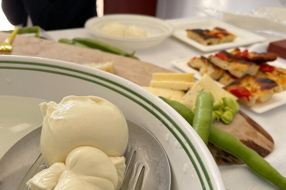 a plate of food with cheese and vegetables on a table