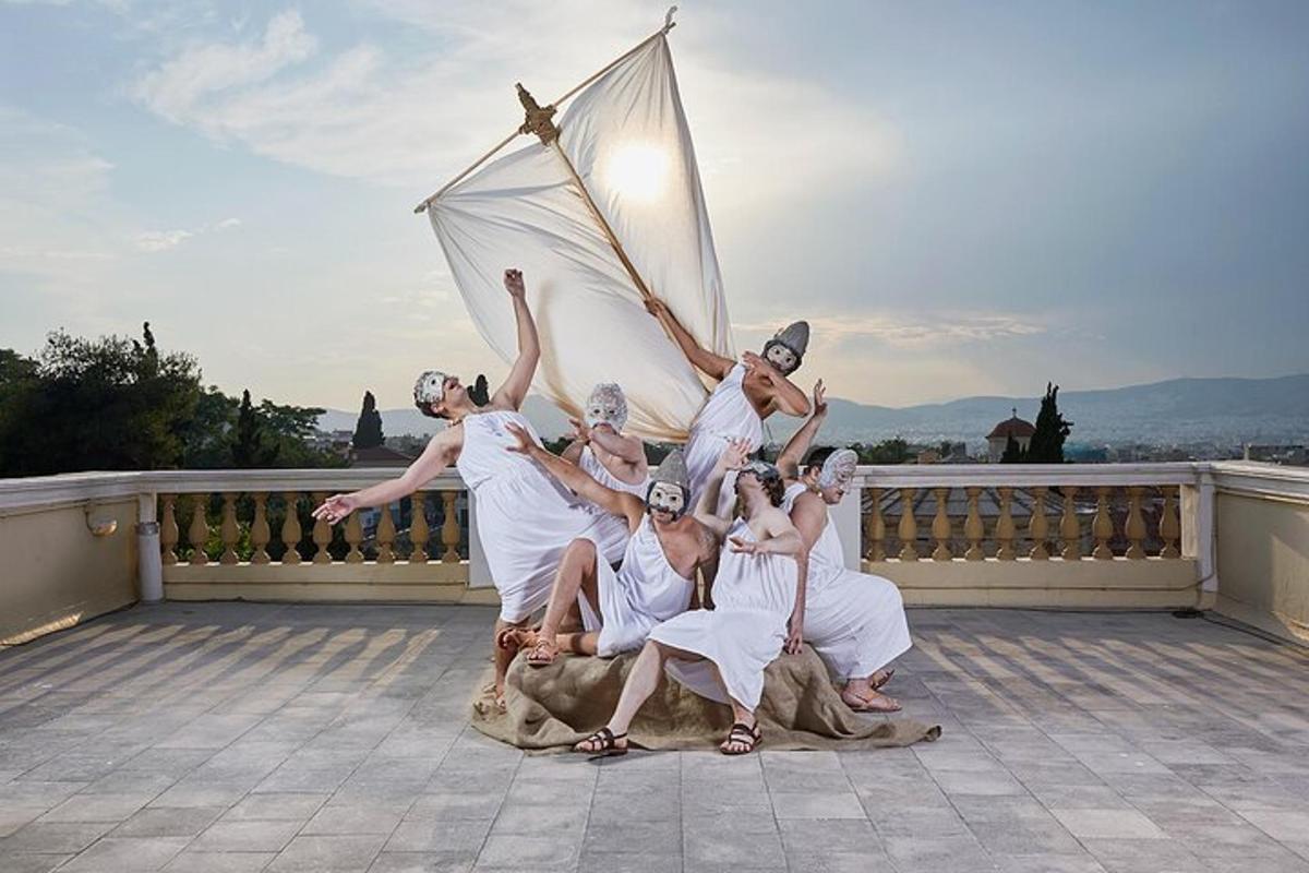 a group of people in white posing for a picture