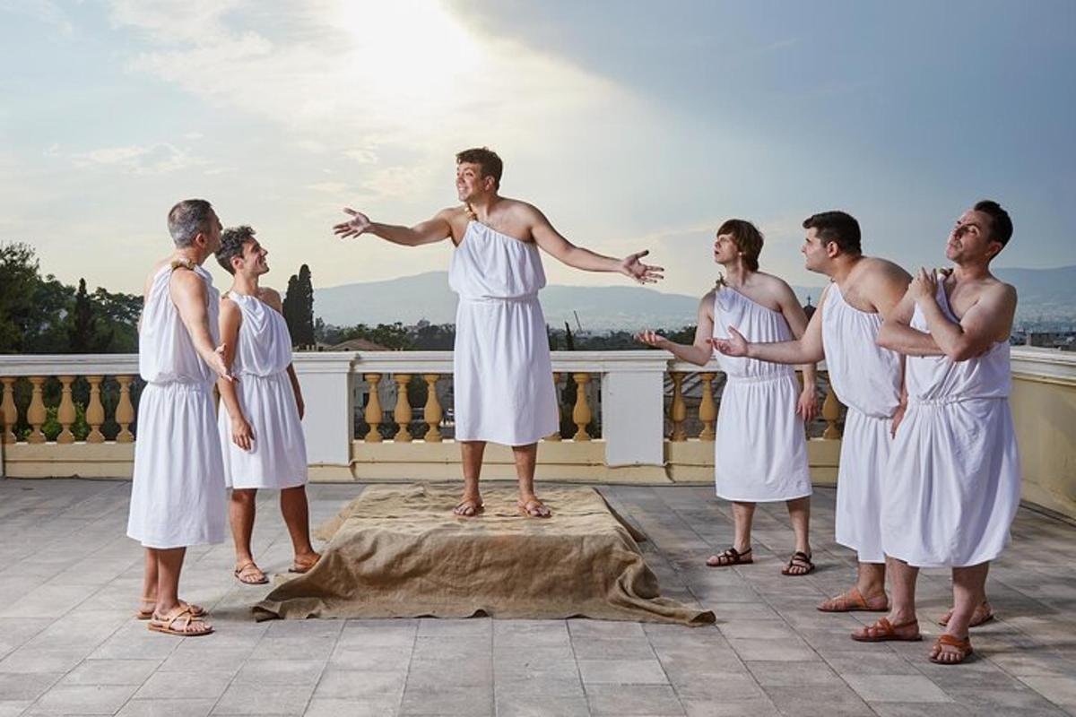 a group of men in white robes standing in a yoga pose