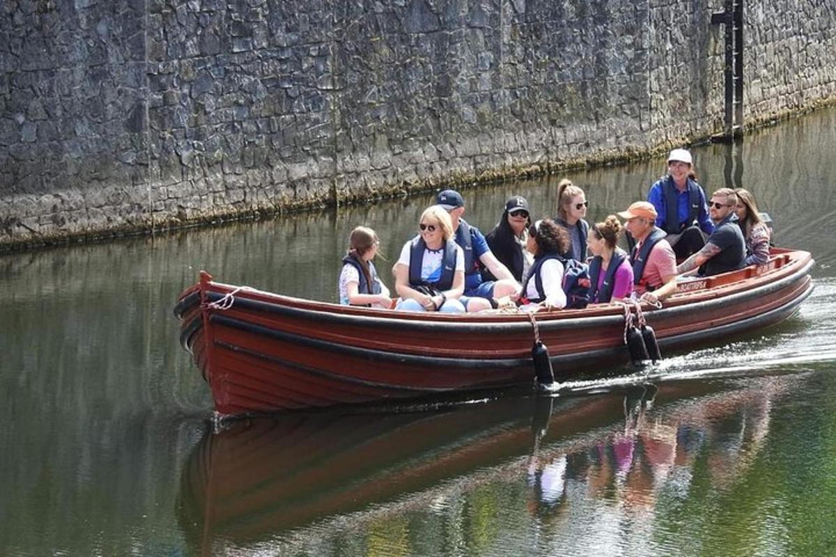 a group of people in a boat in the water