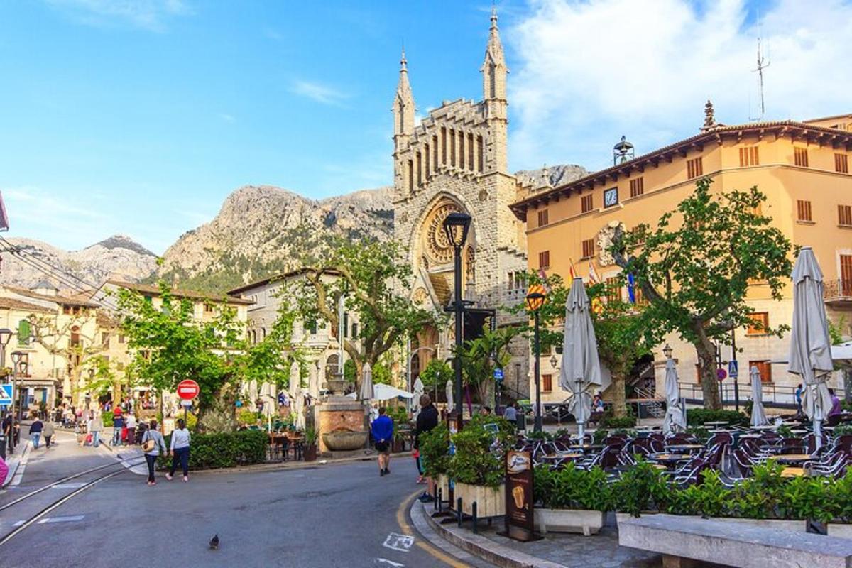 a street in a city with a church in the background