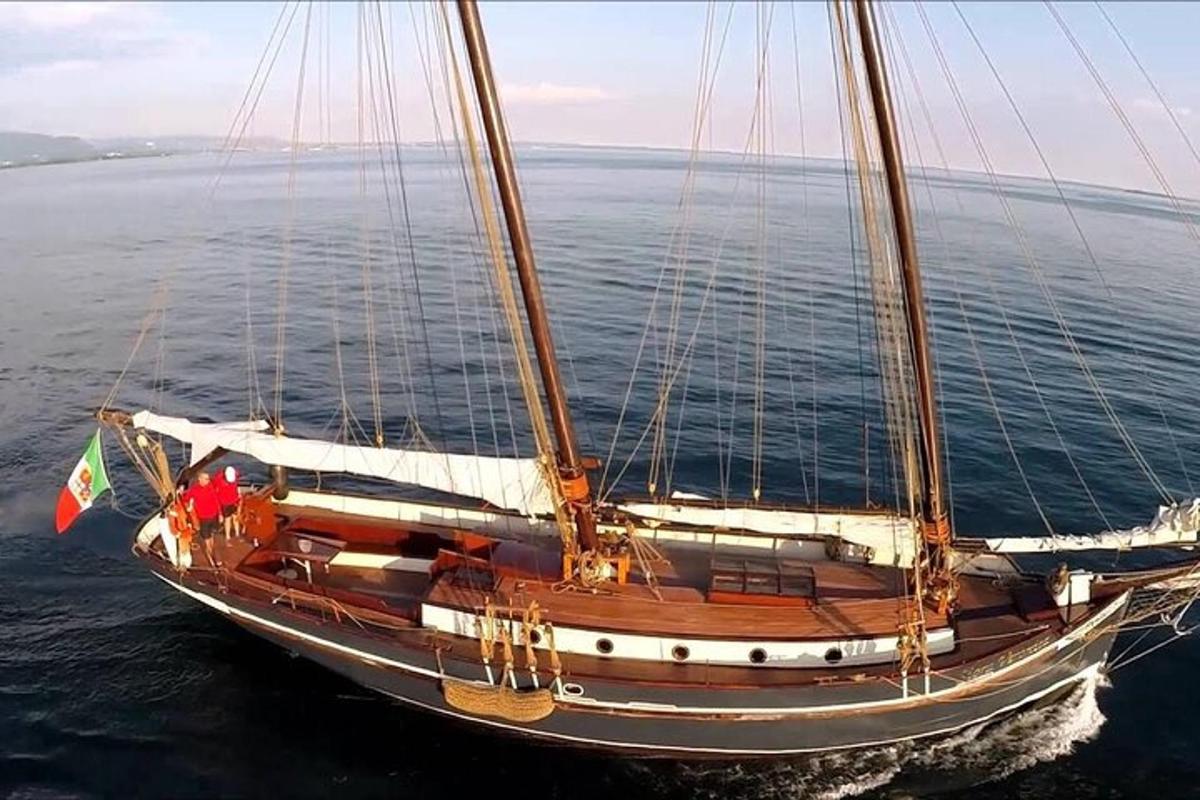 a sail boat in the water on the ocean