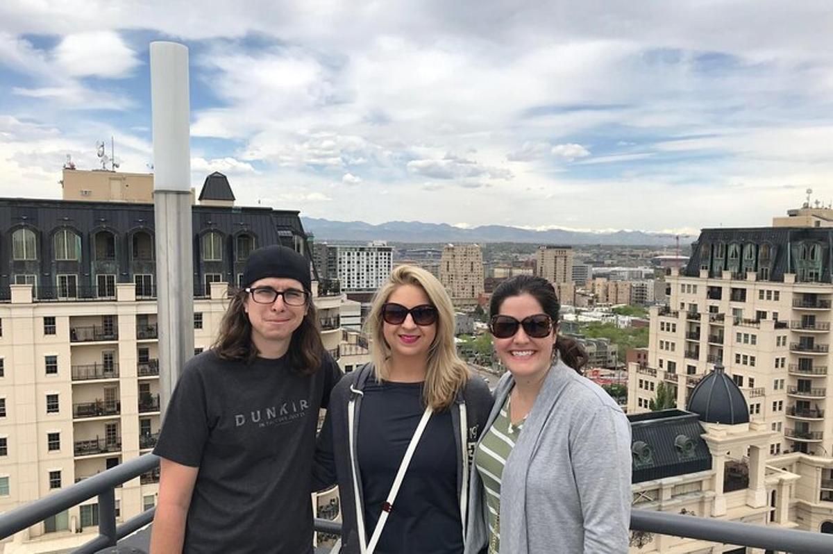 a group of people standing on top of a building