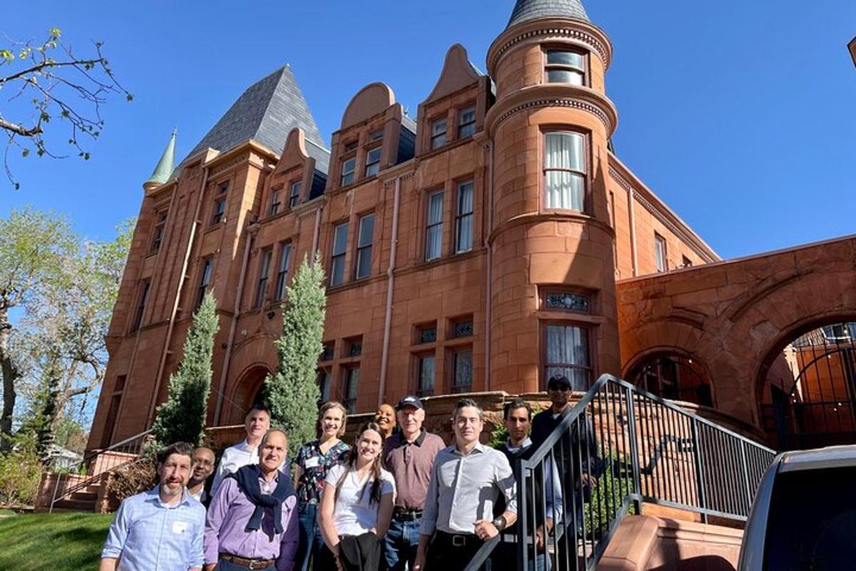 a group of people standing in front of a building