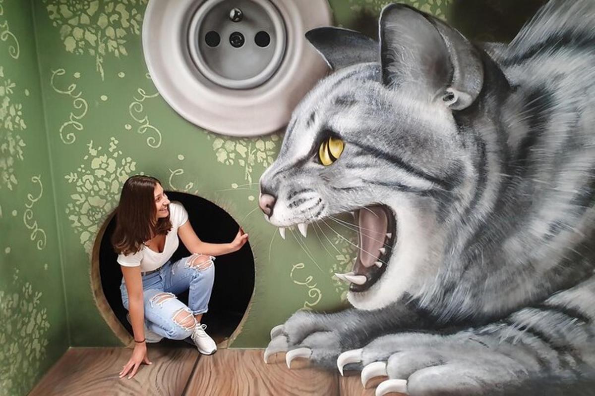 a woman in a room with a painting of a cat