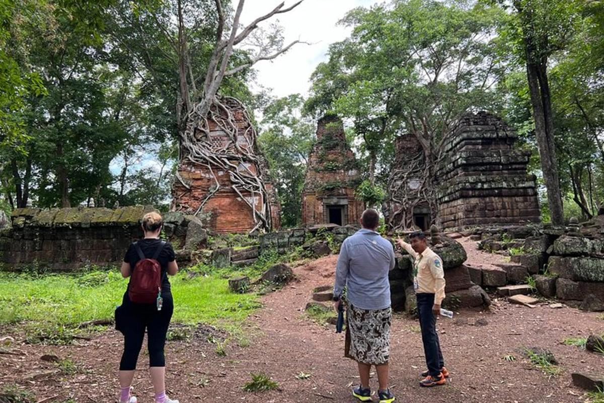 a group of people standing in front of a temple