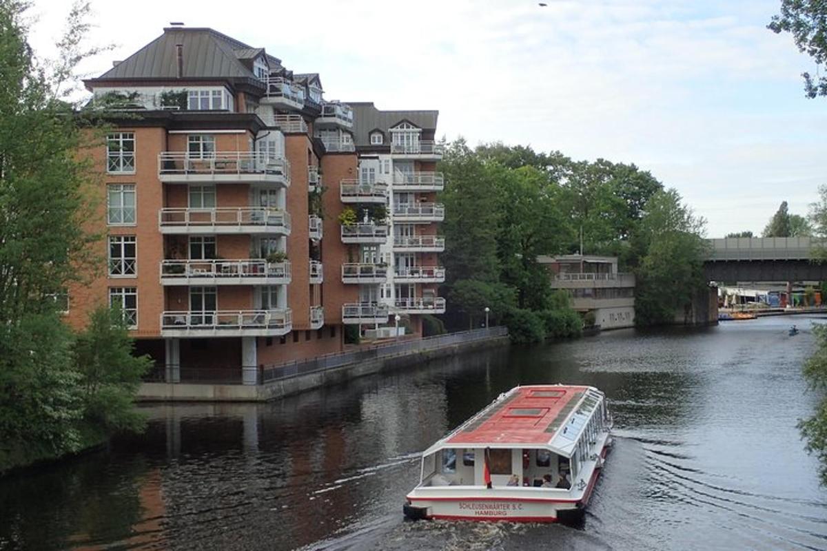 a boat in a river in front of a building