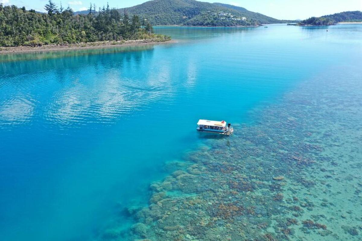 a boat in the middle of a large body of water