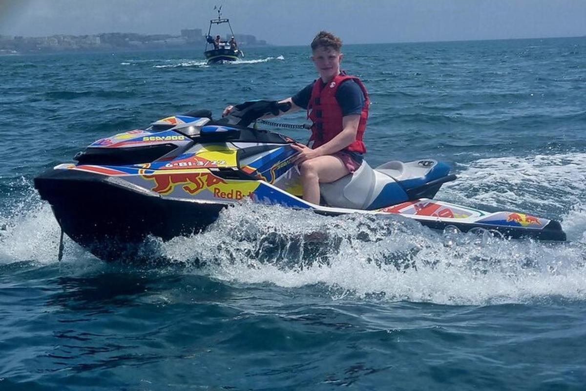 a man riding a jet ski in the water