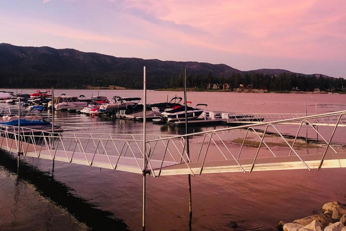 a group of boats docked at a dock in the water